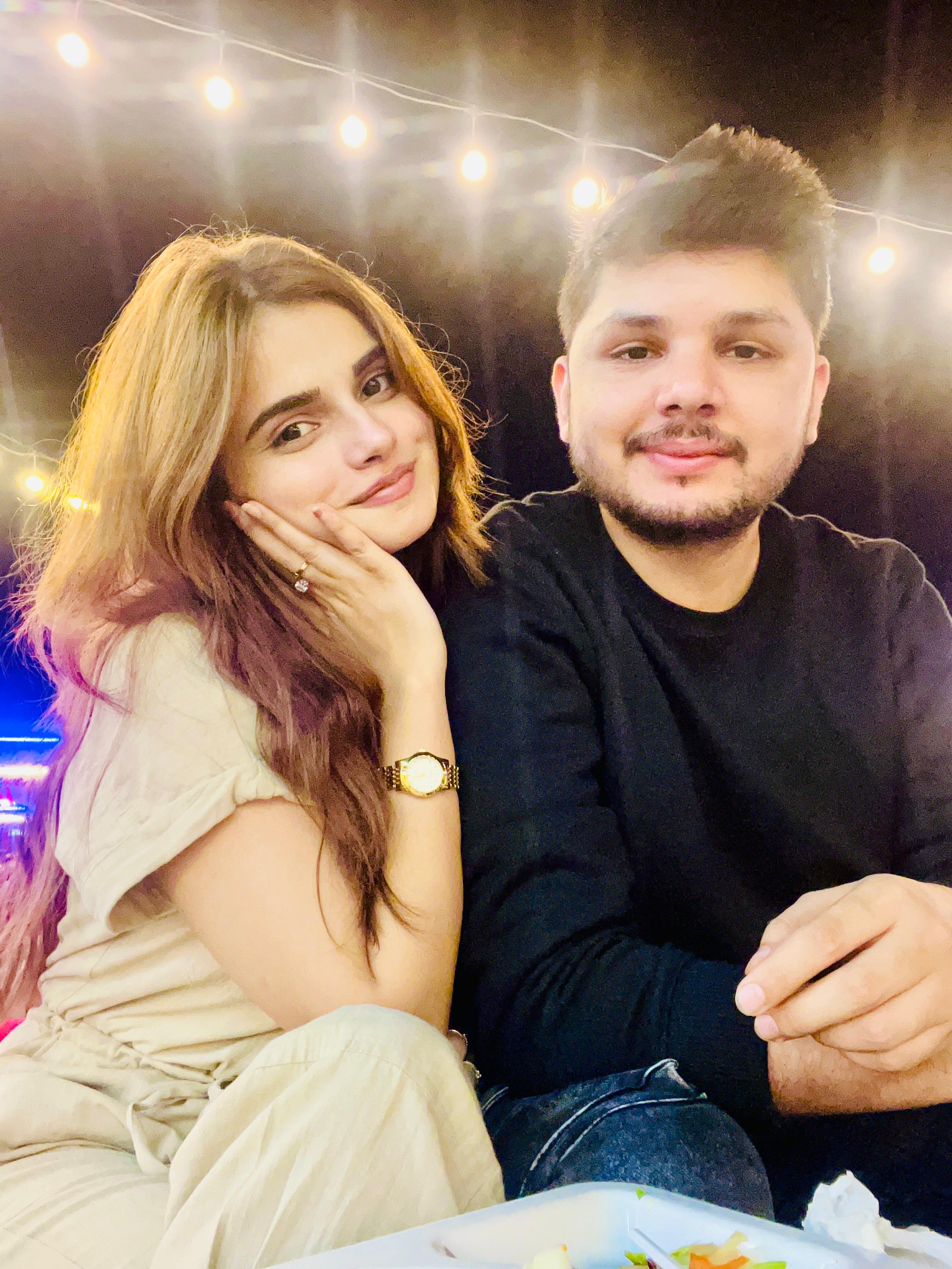 Sunny and Ayesha under string lights