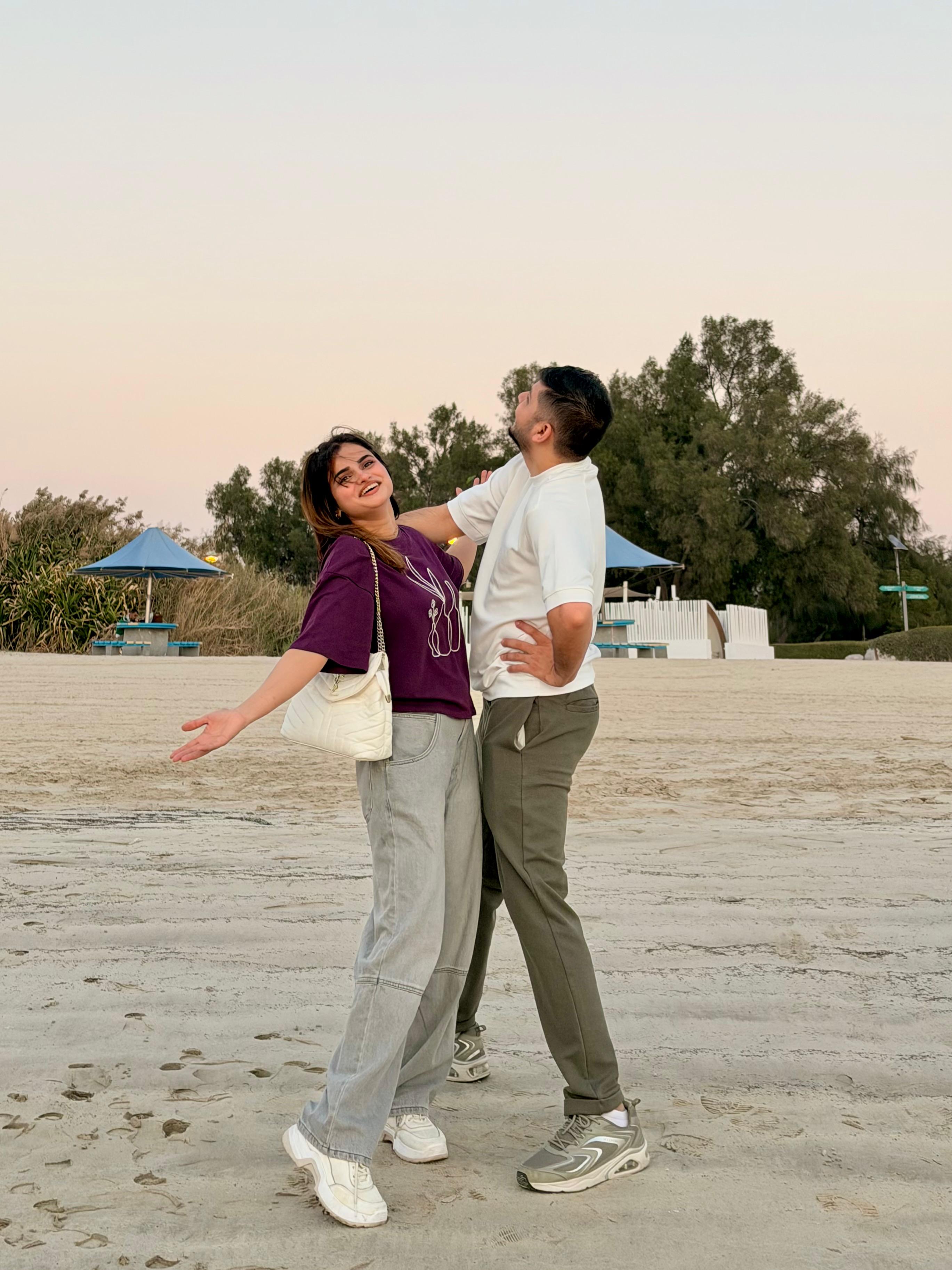 Sunny and Ayesha walking on sunny promenade